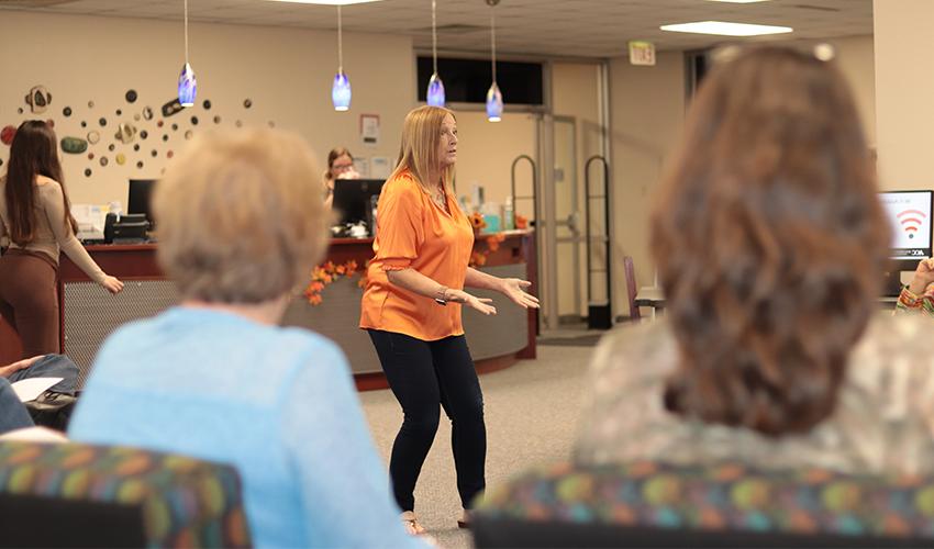 Vicki Marvel standing in front of the audience giving her presentation. 